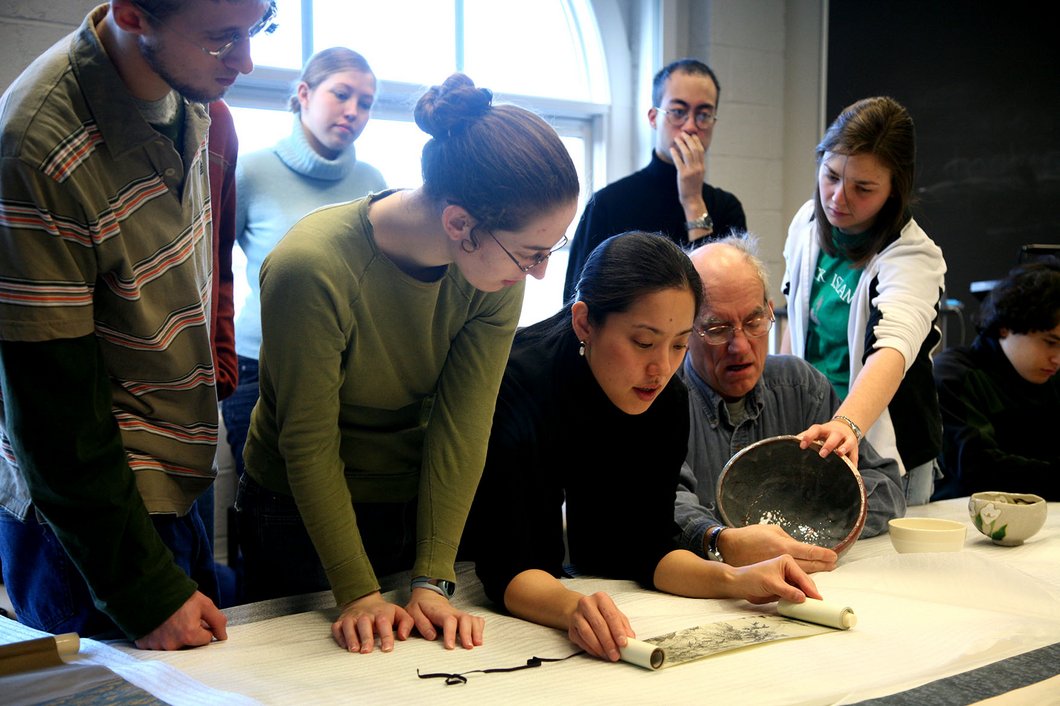 Professor discussing Japanese ceramics with students